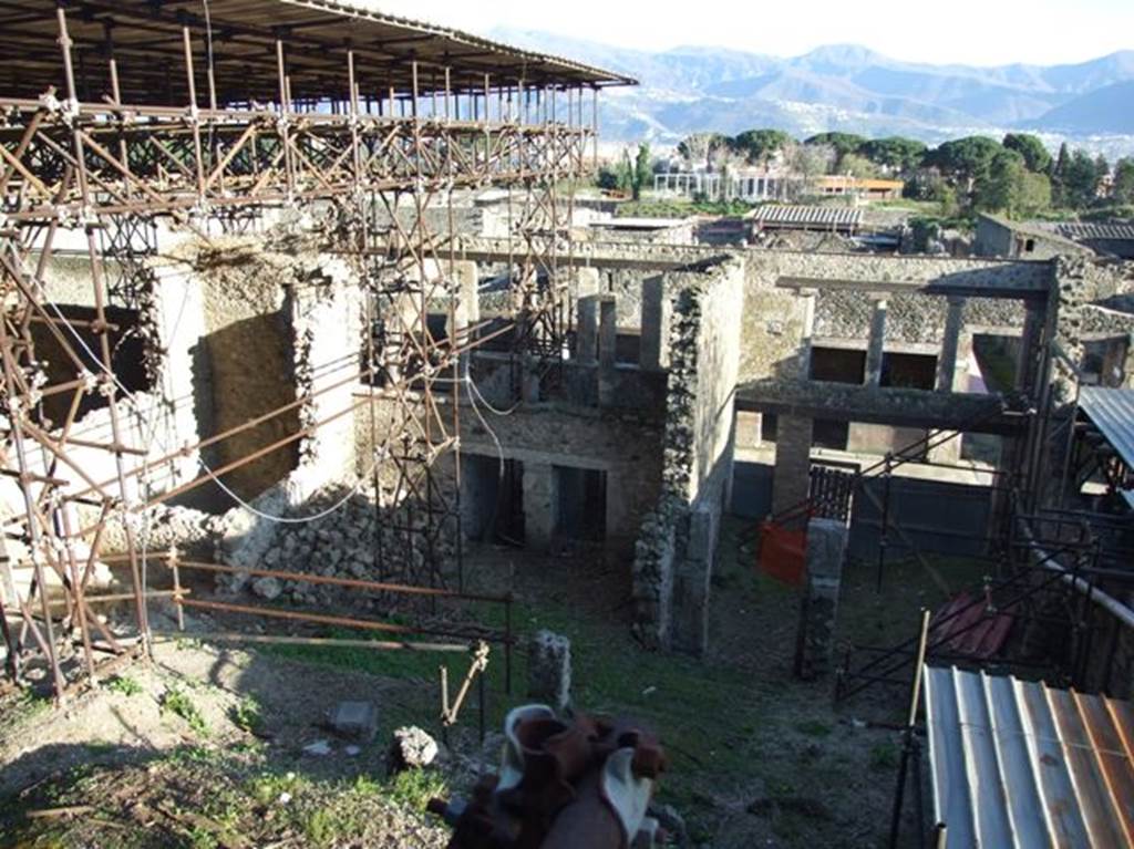 IX.12.5, IX.12.4, IX.12.3 and IX.12.2 and IX.12.1 Pompeii. March 2009. Looking south from rear.