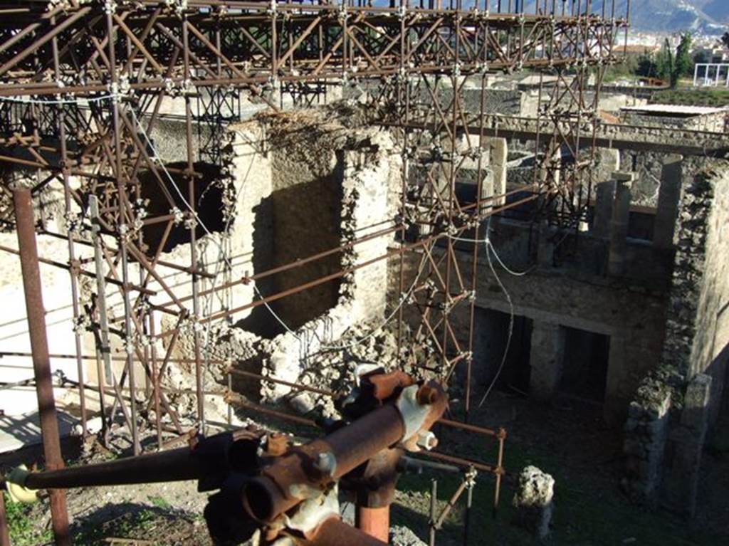 IX.12.5, IX.12.4 and IX.12.3 Pompeii. March 2009. Showing rear view of upper terrace , and partly excavated rooms below.