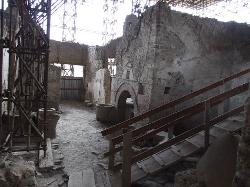 IX.12.6 Pompeii. December 2006. Looking south across the bakery room “e”, from room “f”.
