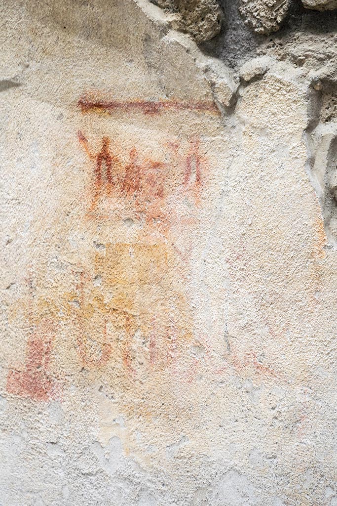 IX.12.6 Pompeii. July 2024.
Room “n1”, preparatory sketch for lararium, on west wall. Photo courtesy of Johannes Eber.