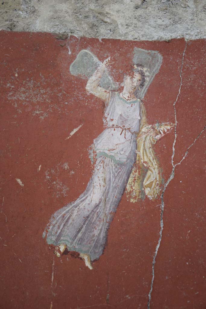 IX.12.6 Pompeii. February 2017.
Room “m”, detail of flying figure from south side of central painting on west wall.
Photo courtesy of Johannes Eber.