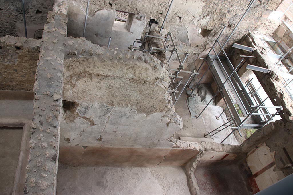 IX.12.6 Pompeii. October 2024.
Looking east from above room “c2”, lower centre left, towards shop-room and rear room of IX.12.7. Photo courtesy of Klaus Heese.