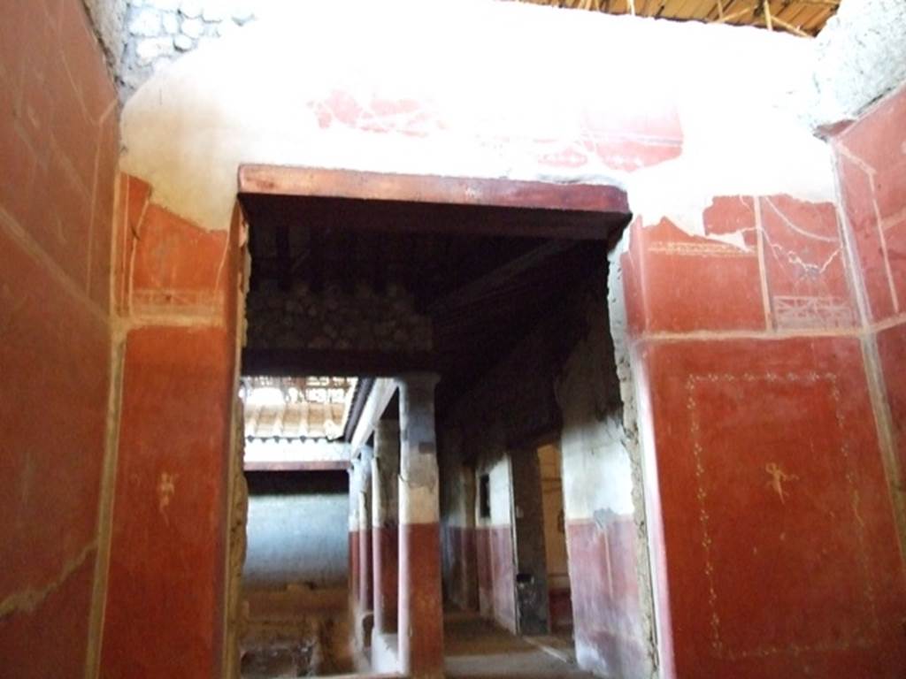 IX.12.9 Pompeii. March 2009. Room 3, west wall of cubiculum, with doorway looking west across north portico 5b.
.