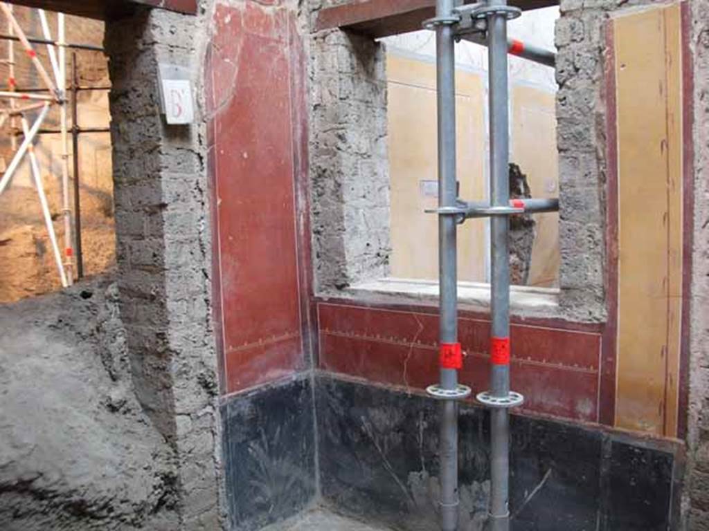 IX.12.9 Pompeii. May 2010.
Room 11, west wall with doorway blocked by volcanic debris, north-west corner, and north wall with window into room 12.