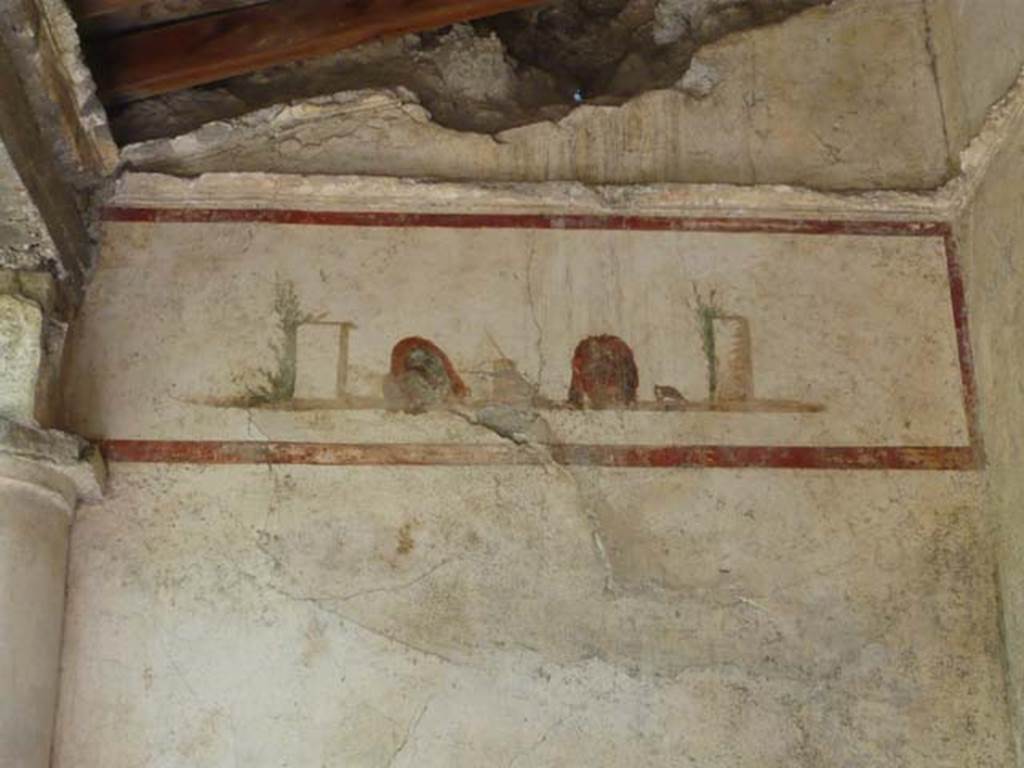 IX.13.1-3 Pompeii. May 2012. Room 9, detail from north-west corner of peristyle.
Photo courtesy of Buzz Ferebee.