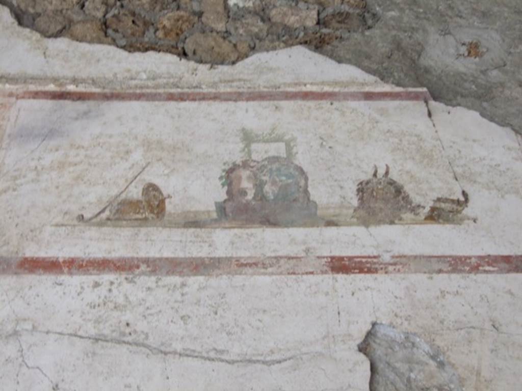 IX.13.1-3 Pompeii. March 2009. Room 9, upper level on north wall of north portico, above the doorway to room 10. Painting of masks.