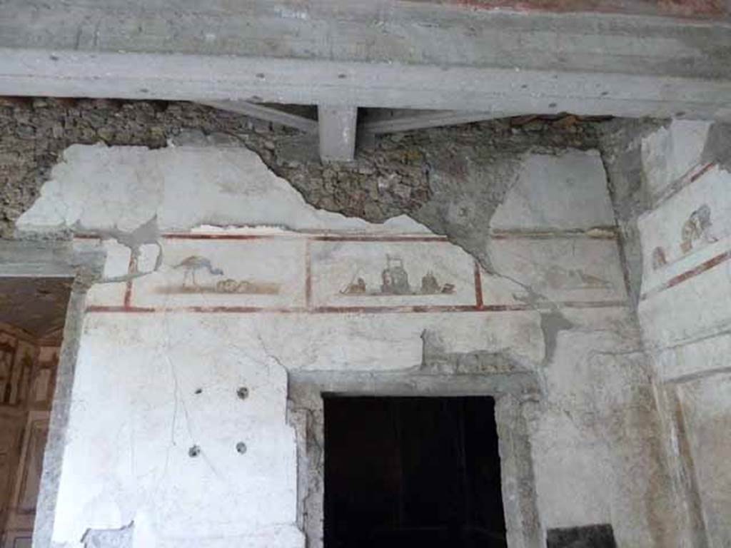IX.13.1-3 Pompeii. May 2010. Room 9, upper level on north wall of north portico, above room 10.