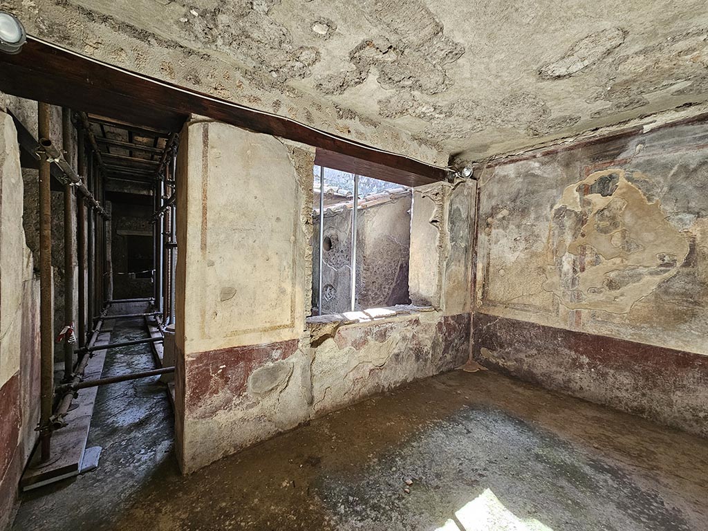 IX.13.3 Pompeii. November 2024.
Room 22, looking towards doorway to kitchen courtyard and south wall. Photo courtesy of Annette Haug.