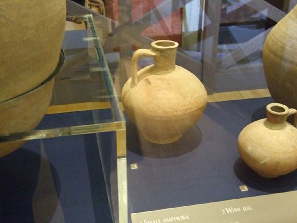 IX.13.3 Pompeii. Wine jug with narrow neck (In the centre rear). SAP 21574. Photographed at “A Day in Pompeii” exhibition at Melbourne Museum. September 2009.