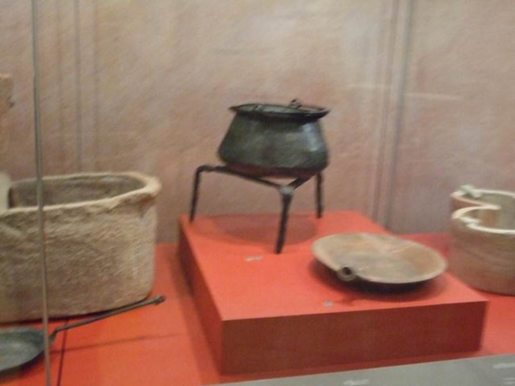 IX.13.3 Pompeii. Padella or frying pan (At centre front). SAP 22844.
Photographed at “A Day in Pompeii” exhibition at Melbourne Museum. September 2009.