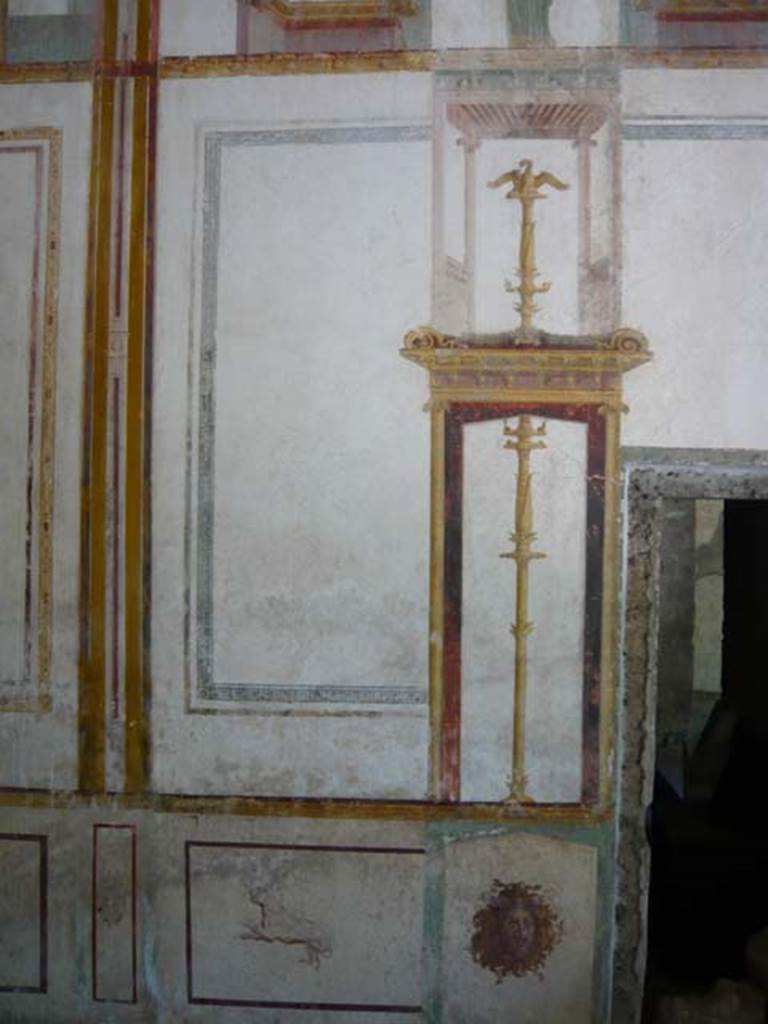 IX.13.1-3 Pompeii. May 2012. Room 11, detail from south end of east wall, near doorway to room 10. Photo courtesy of Buzz Ferebee.