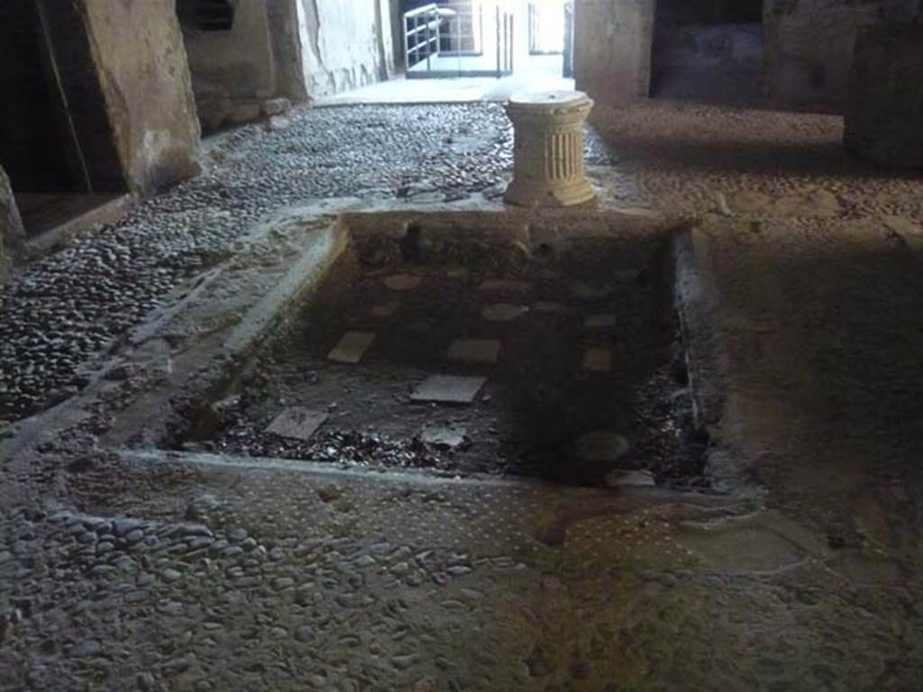 IX.13.1-3 Pompeii. May 2012. Room 2, atrium. Looking south across impluvium.
Photo courtesy of Buzz Ferebee.