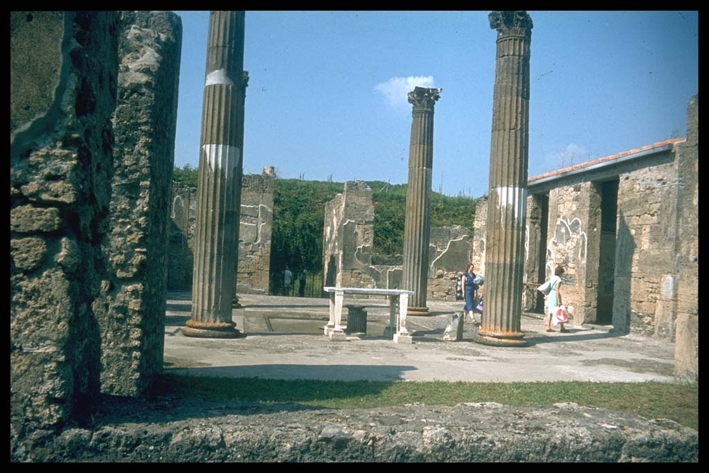 IX.14.4 Pompeii. Looking north across atrium B towards entrance doorway and fauces A.
Photographed 1970-79 by Günther Einhorn, picture courtesy of his son Ralf Einhorn.
