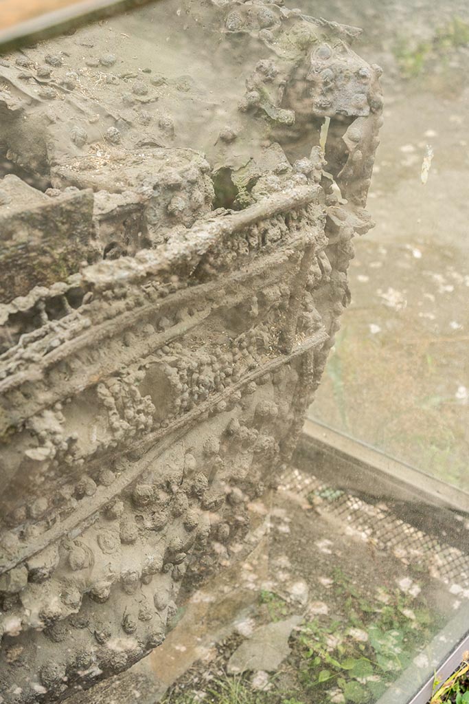 IX.14.4 Pompeii. July 2024. 
Arca or money chest, detail from front (east) side at north end. Photo courtesy of Johannes Eber.
