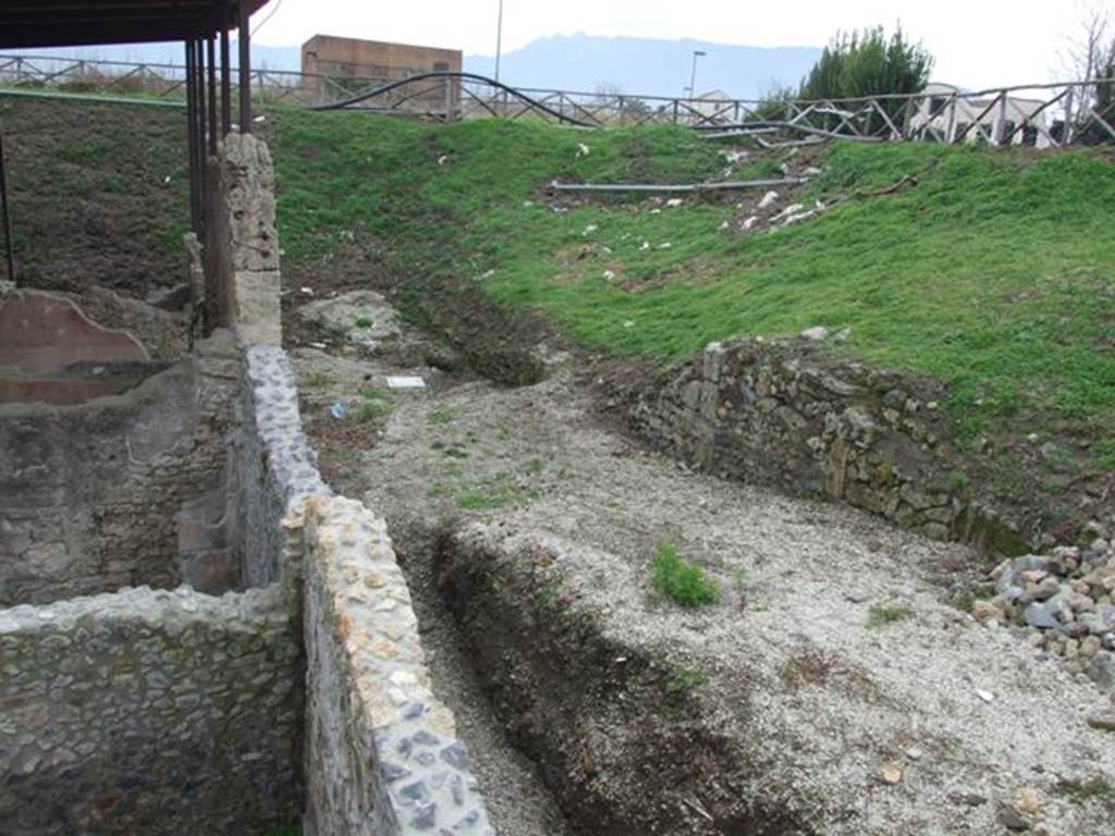 IX.14.4 Pompeii. December 2007. Looking south west into unexcavated vicolo from rear upper level.