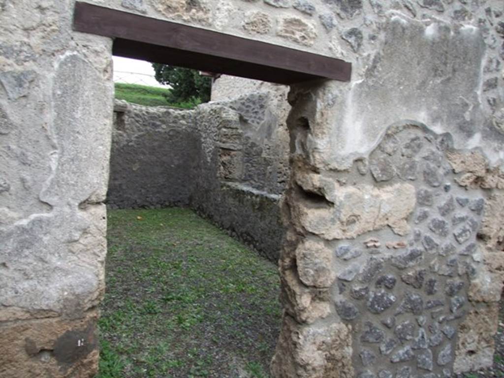 IX.14.4 Pompeii. December 2007. Doorway to room 7, in south-east corner, next to room with latrine.