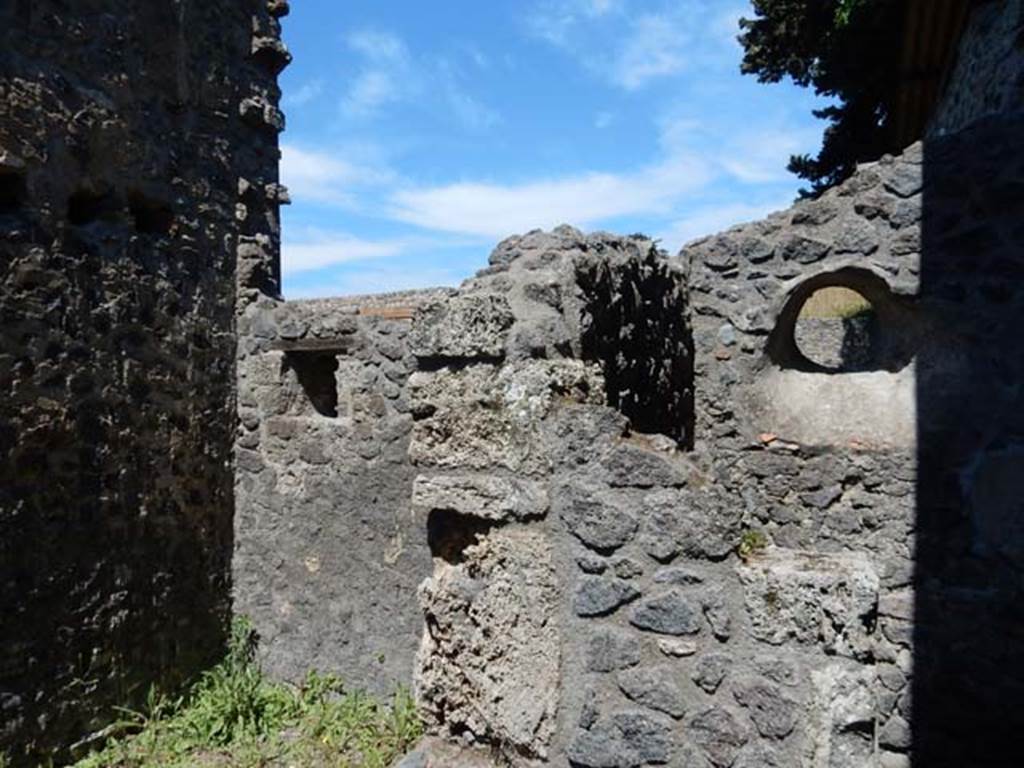 IX.14.4 Pompeii. May 2017. Looking north-east from room 8, towards the latrine of room 8, on right, and east wall of the neighbouring room 7, on left. Photo courtesy of Buzz Ferebee.