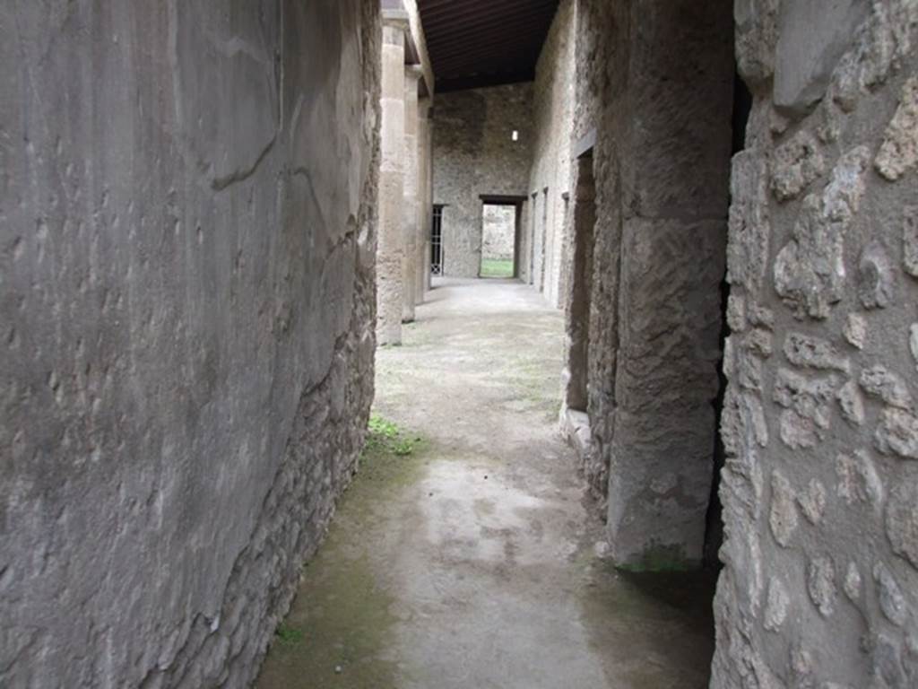IX.14.4 Pompeii. December 2007. Looking south along corridor towards peristyle 1, with doorway to kitchen, room 18, on right.