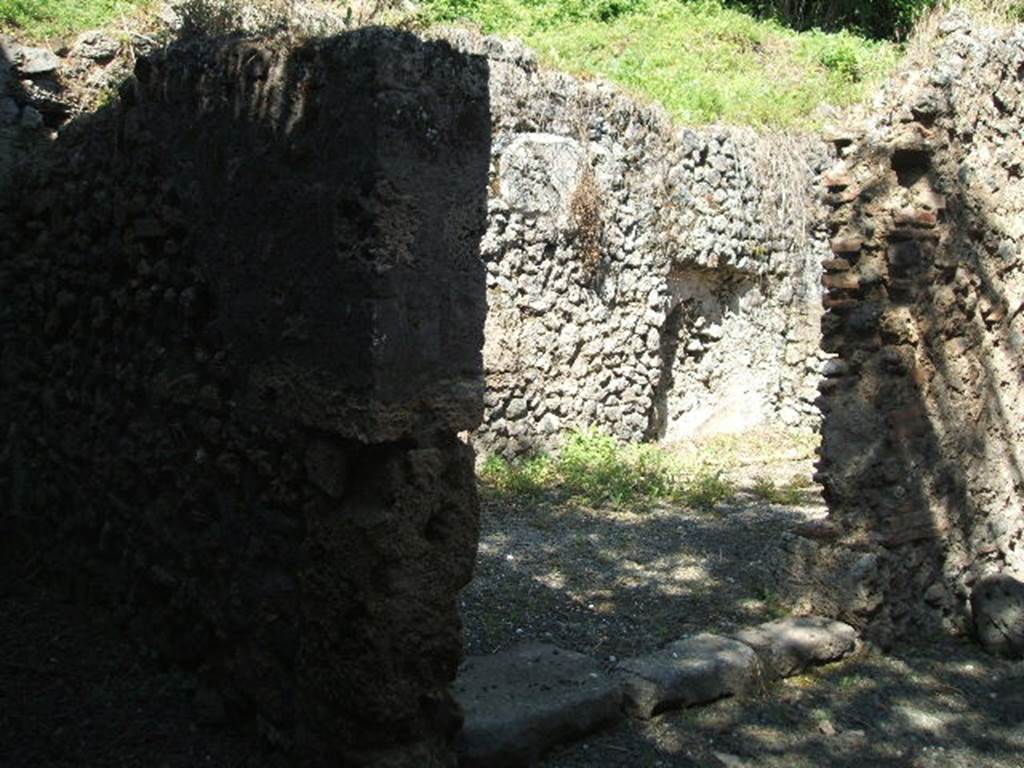 IX.14.b Pompeii. May 2005. Room in south west corner of IX.14.4.
Doorway leading to room with entrance, now blocked.