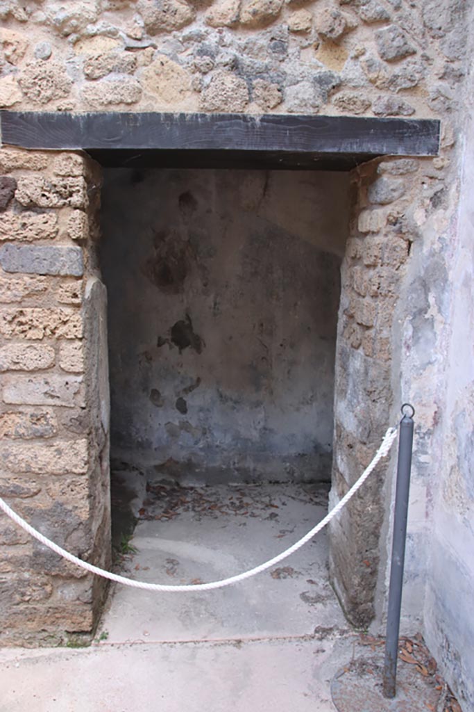 Villa of Diomedes, Pompeii. October 2023.
Looking east into doorway to steps to upper floor, at east end of room 5,a. Photo courtesy of Klaus Heese.