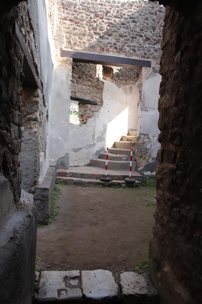 Villa of Diomedes, Pompeii. October 2023.
Room 5,18, looking east towards steps up to peristyle, from end of corridor 5,12.
Photo courtesy of Klaus Heese.