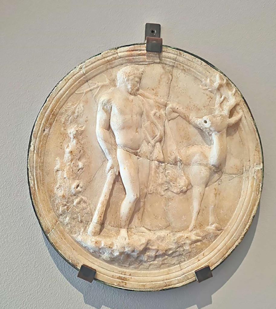 Villa of Diomedes, Pompeii. October 2023.
Marble decorative hanging relief (oscilla) showing Hercules and the hind of Ceryneia. Photo courtesy of Giuseppe Ciaramella.
On display in “L’altra MANN” exhibition, October 2023, at Naples Archaeological Museum.