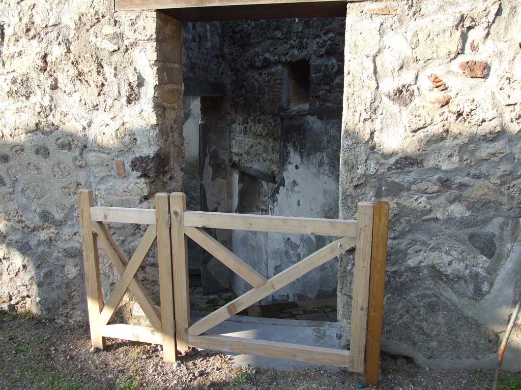 HGW24 Pompeii. December 2006. Doorway to steps to lower level.
From PAH 1,1, p.264-5, 13th June 1772, addendum p. 127 and 158. (see Nos. 46, 47 and 48 below, on the plan by La Vega).
We have initiated the work to recognise a doorway of the aforesaid peristyle, which we believe to be the main doorway of the house, and to evacuate other rooms that were in the above apartment.
Adjoining to the same main doorway, in the internal part of the peristyle, we have dug out a stairway that leads to the lower apartments, and in the entrance we have found a lamp with a bronze wick-holder, shaped like a snail in the act of leaving his shell, and this was made to be placed in any place, having below some hardness which would hold it, or to hang from above by the form of a ring on which was attached a chain, and it was in very good condition.
According to Pagano and Prisciandaro, the inventory number of the lamp is NAP 72261, and further information is in AdE VIII, 66, 301.
See Pagano, M. and Prisciandaro, R., 2006. Studio sulle provenienze degli oggetti rinvenuti negli scavi borbonici del regno di Napoli. Naples: Nicola Longobardi. (p.72).
Here was also found a bronze vase/pot in the shape of a stock-pot.
At the threshold of the entrance doorway, a small ivory spoon was found (0.11m long).