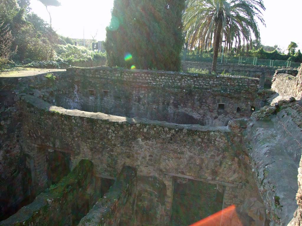 HGW24 Pompeii. December 2006. Looking west, down onto lower area to south of terrace.
(Villa Diomedes Project – looking across area 52 on left, corridor 50, and area 53, on right).
(Fontaine, looking across rooms (from left) 5,4, corridor 5,3, and 5,5, on lower right.
These rooms would have looked out onto the covered portico around the garden area).
No.78 on the plan of La Vega would have been found on the unroofed walkway around the top of the portico, on the south side of the garden area (approximately in this photo, on the upper middle left, flat area). (Fontaine, south side of garden terrace/walkway, near “A” on upper level.
No.80 would have been found on the upper level terrace, approximately where the “red” sunlight has caught the camera lens. This part of the terrace has now collapsed. (Fontaine, near “A” the garden terrace/walkway, west of room 4,5 on upper level.