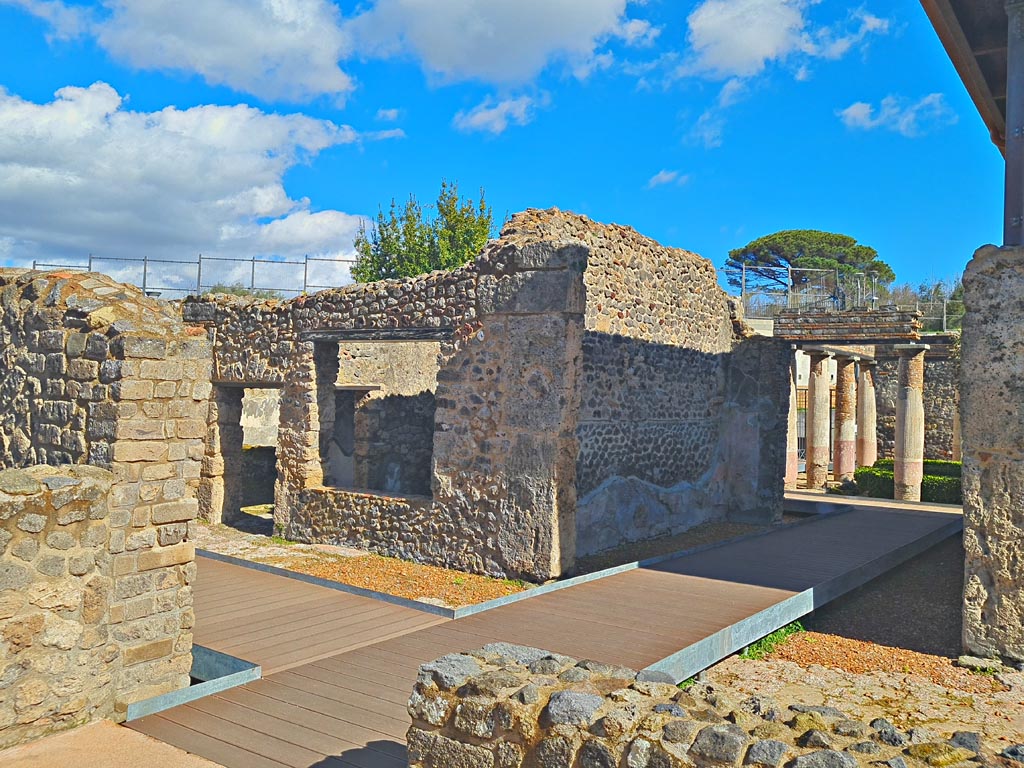 HGW24 Pompeii. Villa of Diomedes. March 2024. From area of terrace/loggia/exedra.
Doorway to corridor (2.4) and window to room (2.6), on left, on north side of tablinum, on right. Photo courtesy of Giuseppe Ciaramella.