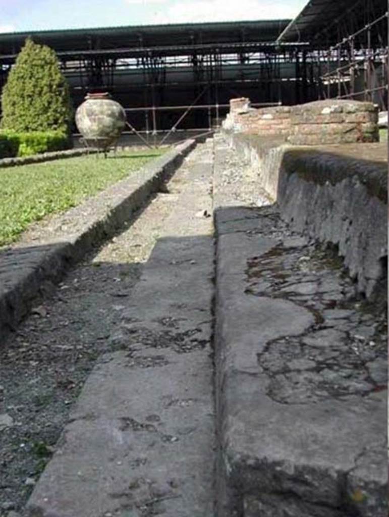 Villa San Marco, Stabiae, December 2007. Area 66, garden peristyle area. Looking east along south side of portico 1.
1.