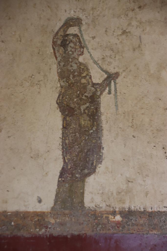 Villa San Marco, Stabiae, October 2022.
Room 8, south-west corner of west wall, detail of figure to left of doorway into room 13.
Photo courtesy of Klaus Heese.