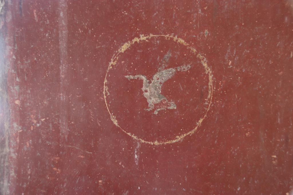 Villa San Marco, Stabiae, October 2022.
Room 8, detail of swan in centre of red panel below figure to right of window on east wall. Photo courtesy of Klaus Heese.