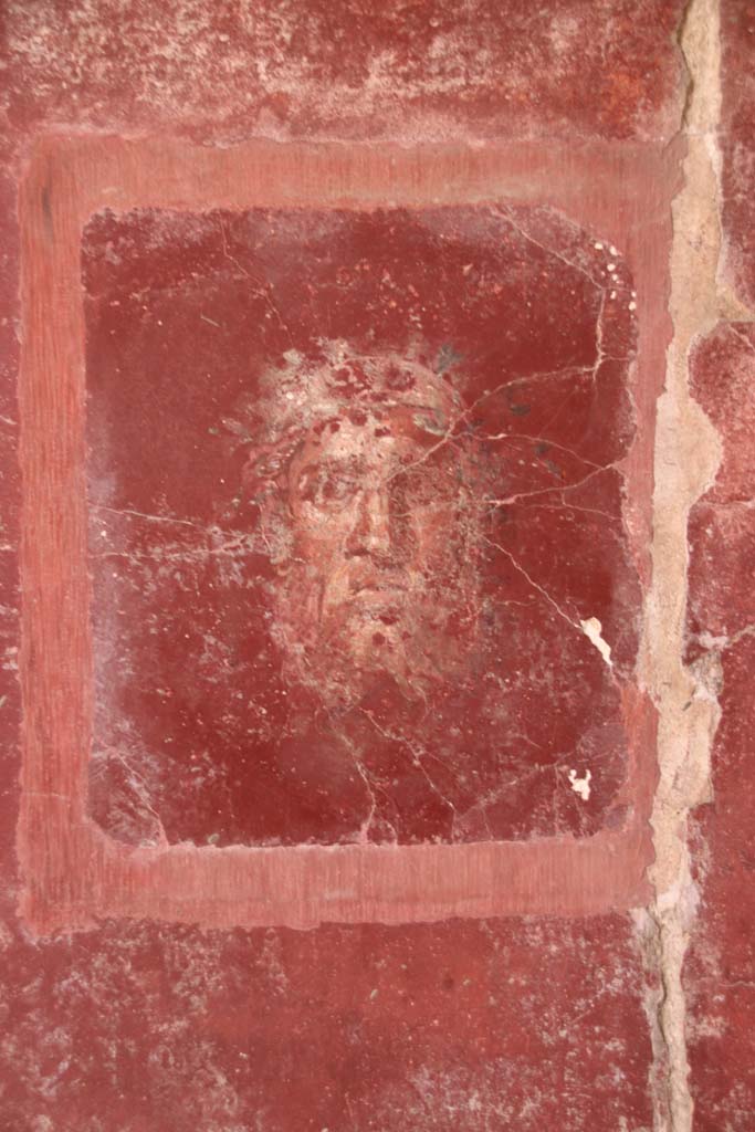 Villa San Marco, Stabiae, October 2020.
Room 44, detail of painted face from east wall in south-east corner. Photo courtesy of Klaus Heese.