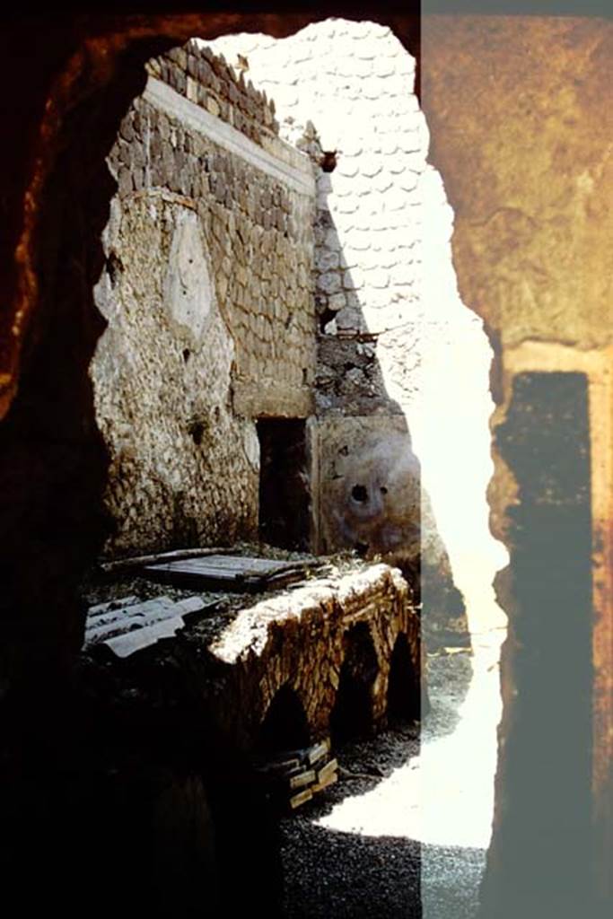 Villa San Marco, Stabiae, c.1960’s (probably 1961). Looking from peristyle through hole in wall into kitchen, room 26. Photo by Stanley A. Jashemski.
Source: The Wilhelmina and Stanley A. Jashemski archive in the University of Maryland Library, Special Collections (See collection page) and made available under the Creative Commons Attribution-Non Commercial License v.4. See Licence and use details. Jmit0130