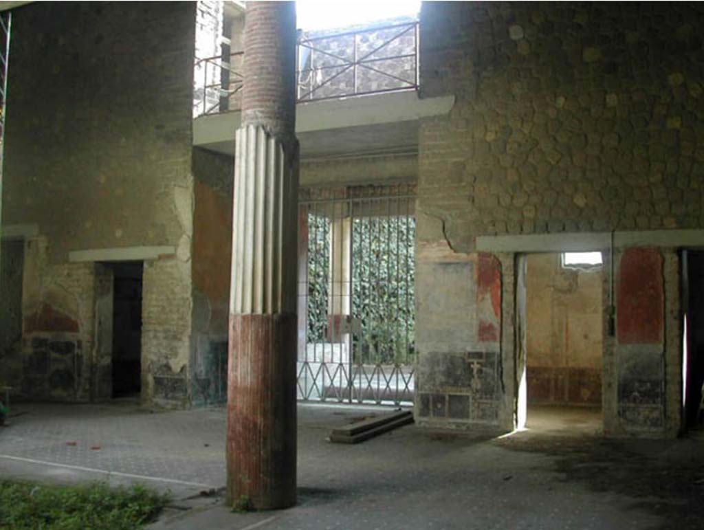 Villa San Marco, Stabiae, December 2007.
Room 44, looking towards south side of atrium, with doorway to room 61 on left, entrance 56 (centre) and room 57 on right.