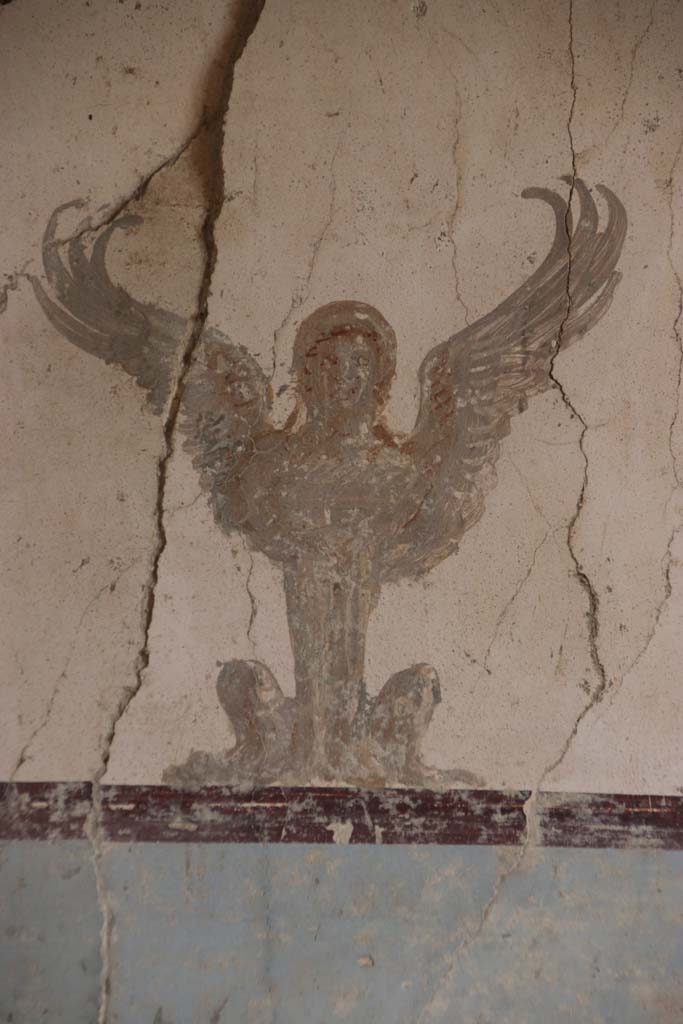 Villa San Marco, Stabiae, September 2019. Room 57, detail of painting of sphynx at top of centre panel of east wall.
Photo courtesy of Klaus Heese.