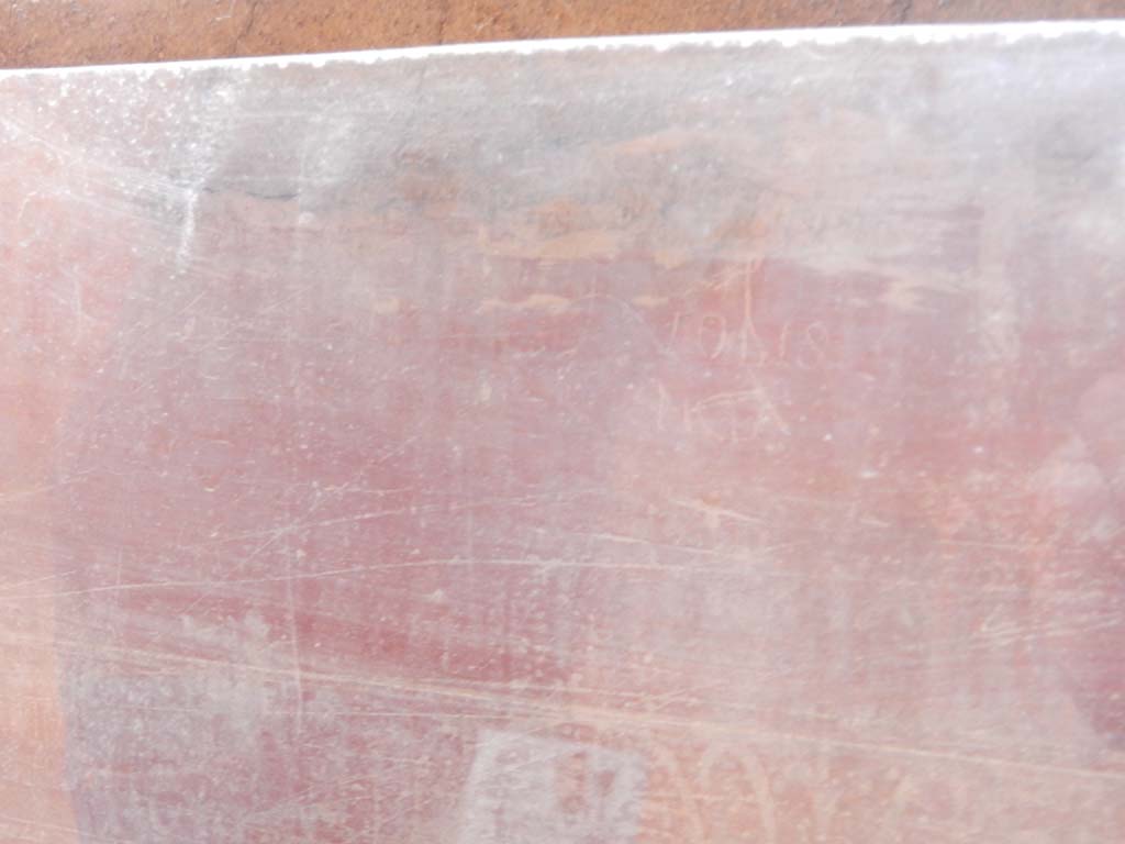 Villa San Marco, Stabiae, June 2019. Corridor 32, graffiti between second and third columns.
Photo courtesy of Buzz Ferebee