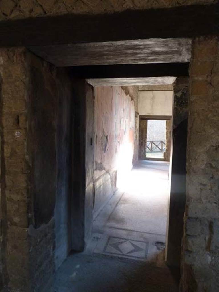 Villa San Marco, Stabiae, September 2015.
Room 23, looking east through doorway to room 25, with mosaic threshold, from south-east corner of room 23.