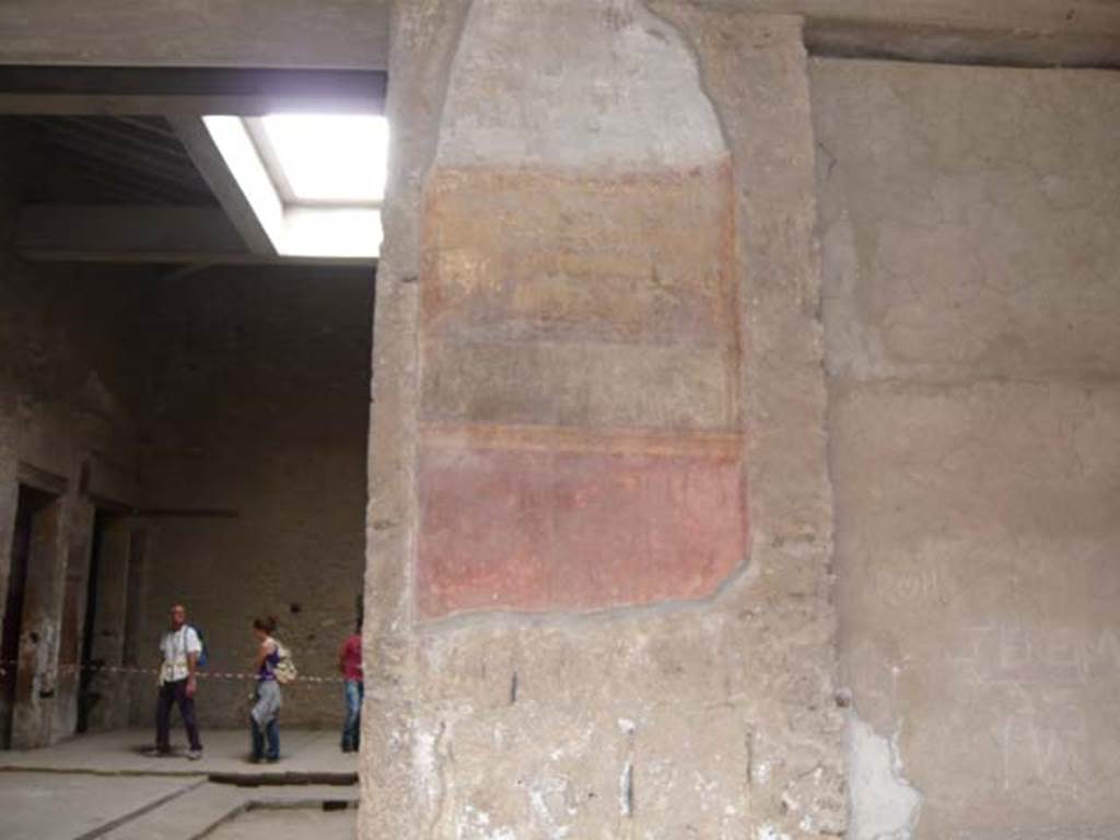 Villa of Mysteries, Pompeii. May 2012. Peristyle A, west wall with remains of wall decoration on north side of room 64, atrium entrance doorway. Photo courtesy of Buzz Ferebee.