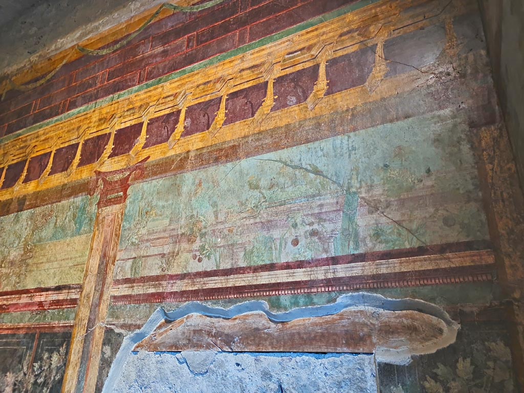 Villa of Mysteries, Pompeii. November 2023.
Room 6, east wall, painted detail from above blocked doorway. Photo courtesy of Giuseppe Ciaramella.