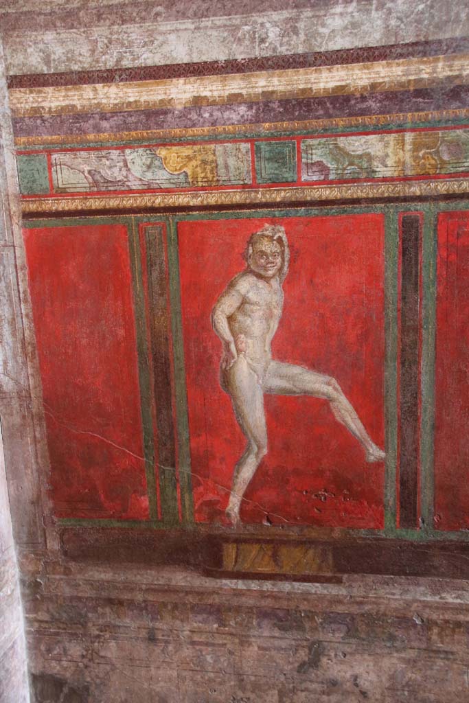 Villa of Mysteries, Pompeii. April 2014. Room 4, detail of wall painting of a dancing satyr, on south wall.
Photo courtesy of Klaus Heese.