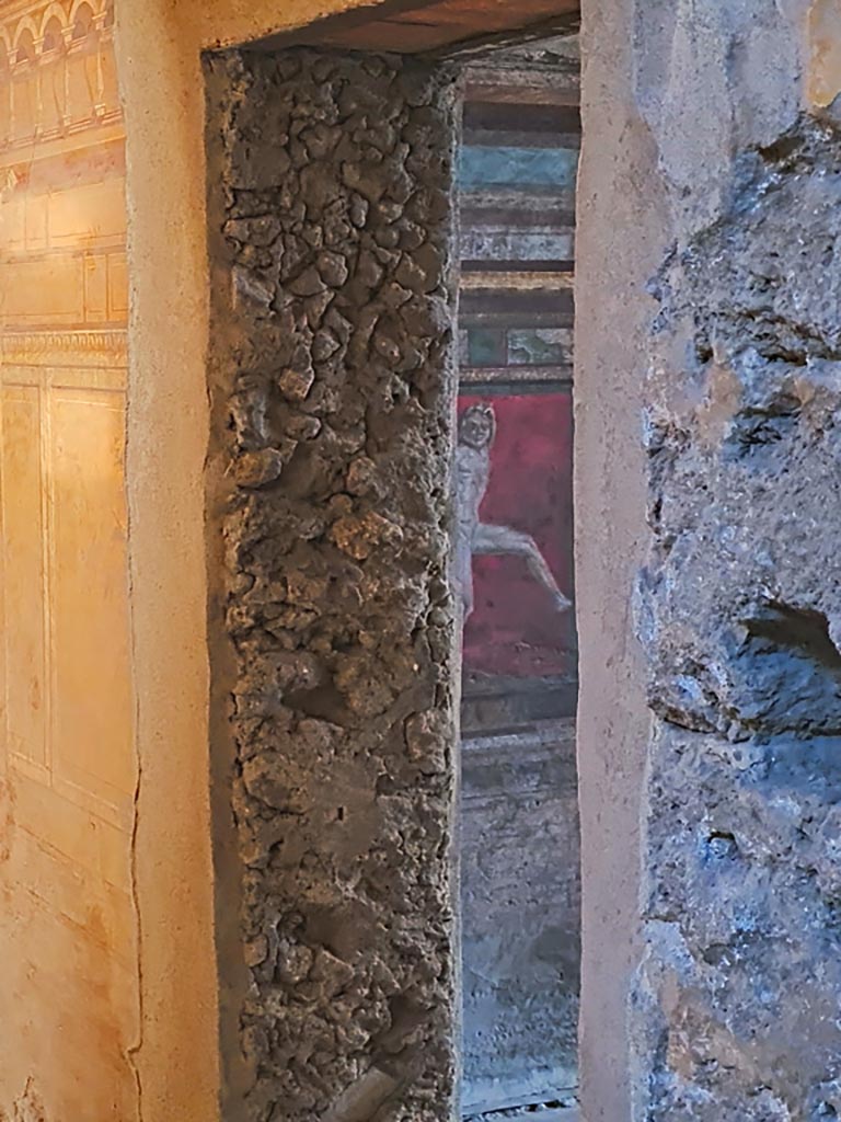 Villa of Mysteries, Pompeii. November 2023.
Room 3, looking through doorway into room 4, with detail of wall. Photo courtesy of Giuseppe Ciaramella.