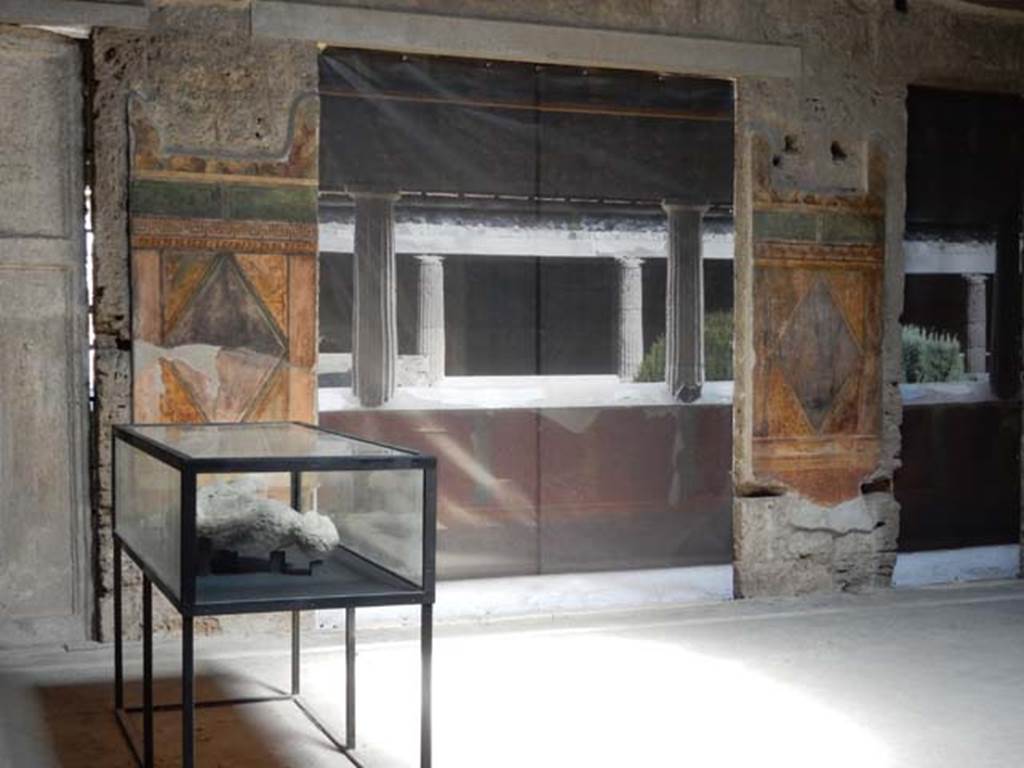 Villa of Mysteries, Pompeii. September 2015. Room 64, looking east across atrium towards blinds with photo of peristyle A imprinted on it, across two of the entrance doorways. Photo courtesy of Buzz Ferebee.