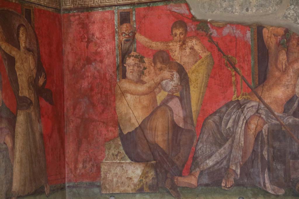 Villa of Mysteries, Pompeii. April 2014.
Room 5, a Silenus and satyrs, theatrical mask in hand, consume wine, detail from east wall of painting of Dionysian mystery, in north-east corner.
Photo courtesy of Klaus Heese.