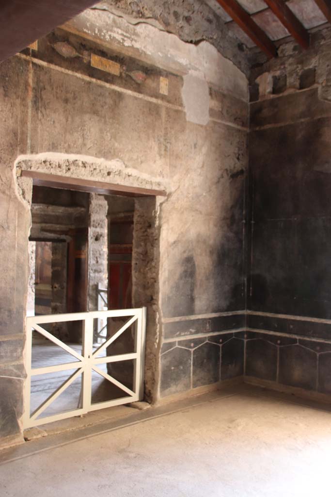 Villa of Mysteries, Pompeii. September 2021.
Room 2, tablinum, looking towards south wall with doorway to room 4, and south-west corner.
Photo courtesy of Klaus Heese.