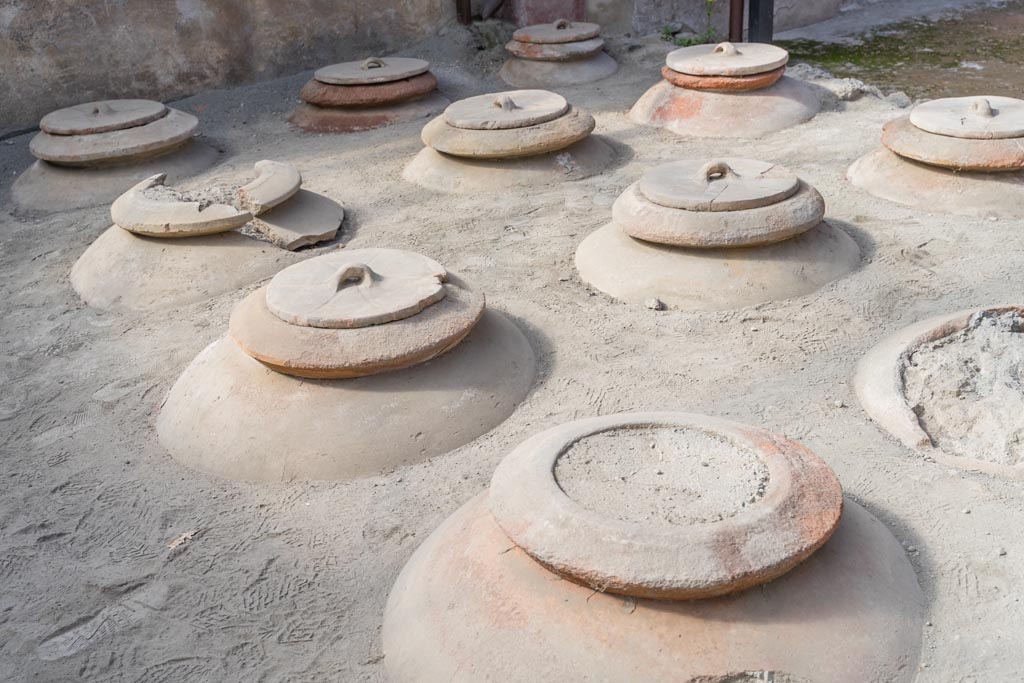 Villa Regina, Boscoreale. October 2021.
Room I, cella vinaria, detail of dolia set into courtyard flooring. Photo courtesy of Johannes Eber.