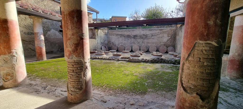 Villa Regina, Boscoreale. December 2023.
Room I, cella vinaria, looking east towards dolia, from west portico. Photo courtesy of Miriam Colomer.