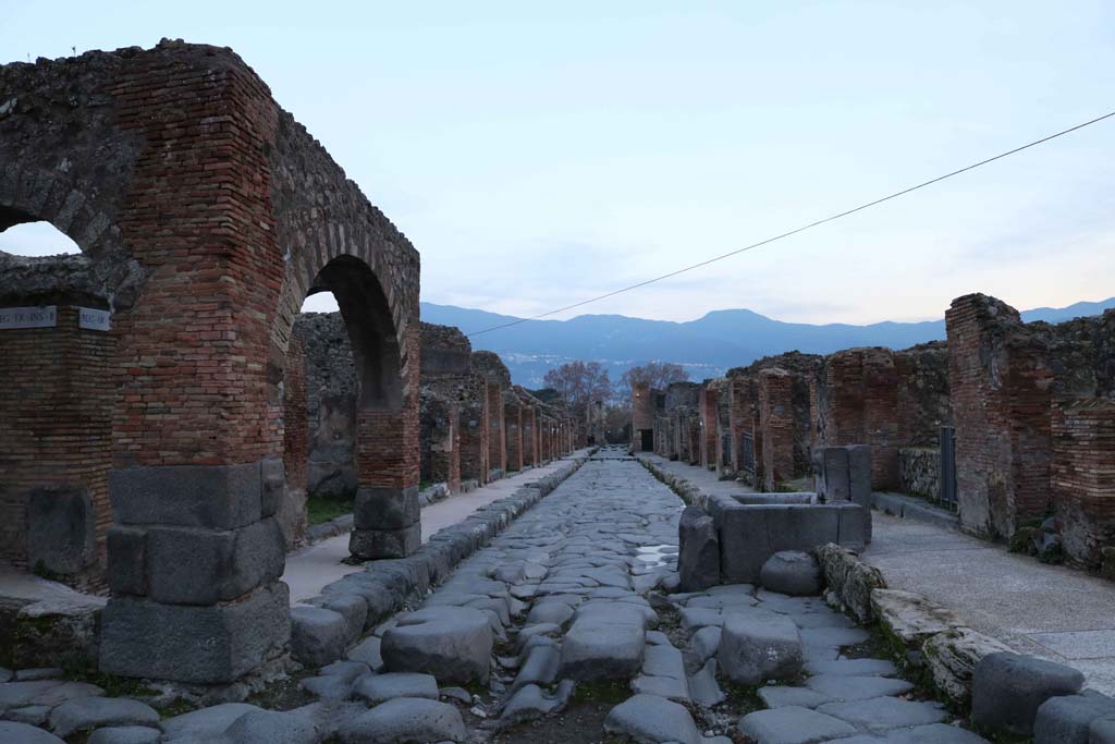 Via Stabiana, at IX.2.1, Pompeii, on left. December 2018.
Looking south between IX.2, on left, and VII.1, on right. Photo courtesy of Aude Durand.