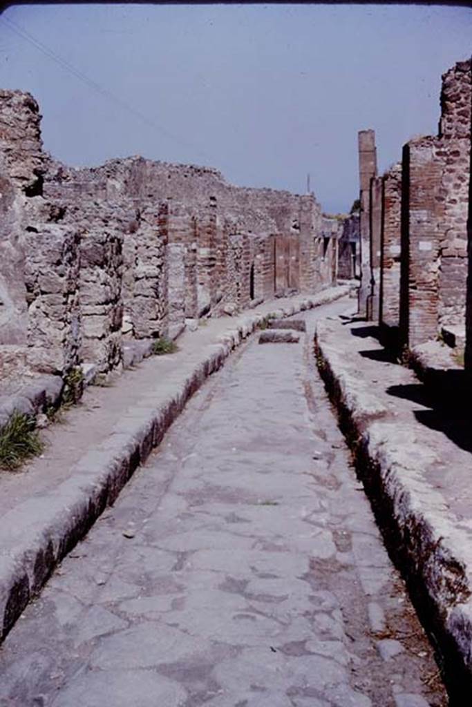Via degli Augustali. Pompeii. 1966. Looking east at roadway surface and wheel ruts worn by traffic. Photo by Stanley A. Jashemski.
Source: The Wilhelmina and Stanley A. Jashemski archive in the University of Maryland Library, Special Collections (See collection page) and made available under the Creative Commons Attribution-Non Commercial License v.4. See Licence and use details.
J66f1014