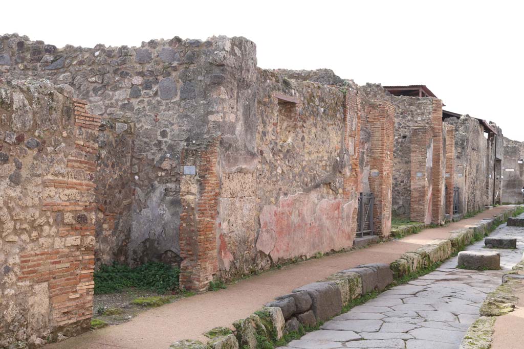Via degli Augustali, Pompeii. December 2018
Looking west along north side of Insula VII.1, on Via degli Augustali, with VII.1.35, on left. Photo courtesy of Aude Durand.